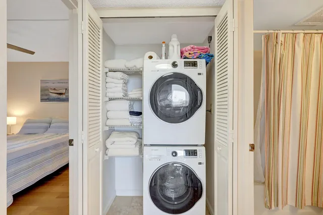 a bedroom with a bed and a table