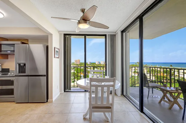 a view of a living room and a balcony