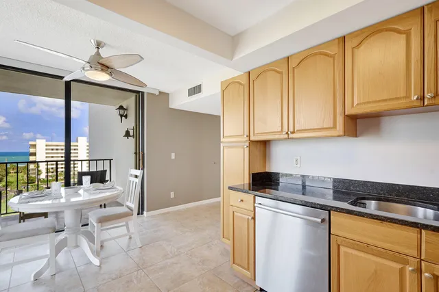 a view of a balcony with wooden floor and fence