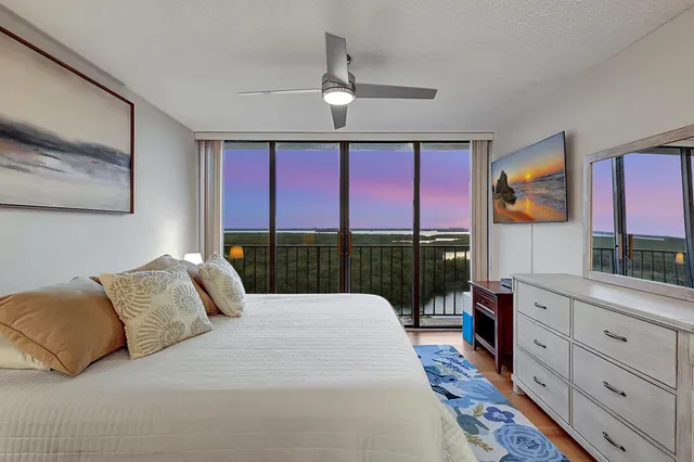 a view of a two chairs in the balcony