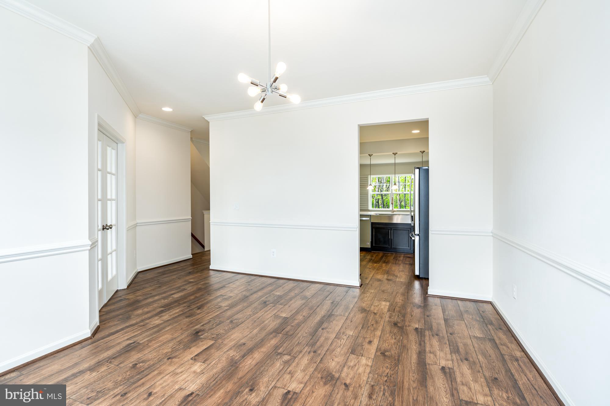 112 Prickly Pear Place Stephenson, VA 22656 - Photo 16 of 31 a view of livingroom with hardwood floor and kitchen space