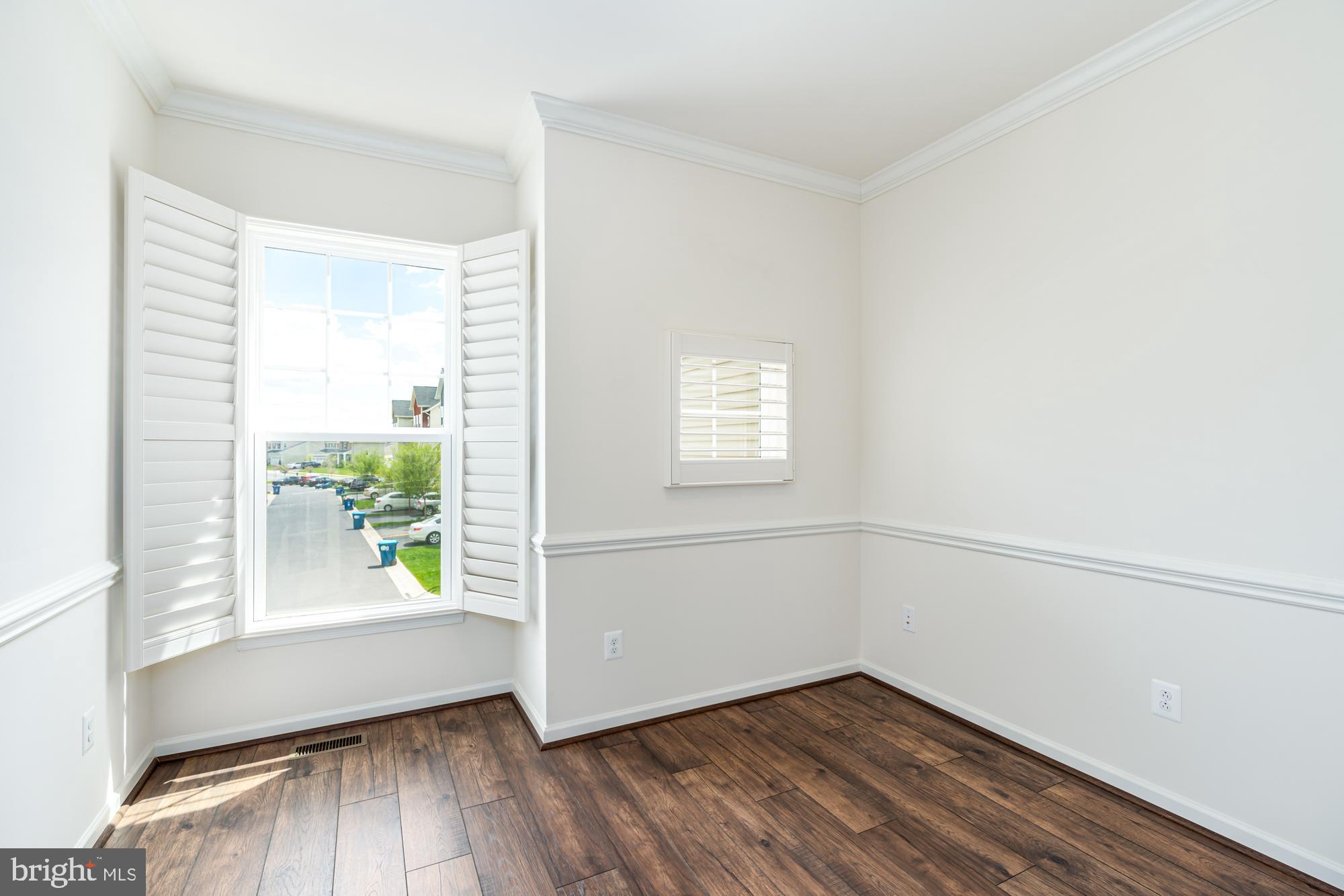 112 Prickly Pear Place Stephenson, VA 22656 - Photo 17 of 31 an empty room with wooden floor and windows