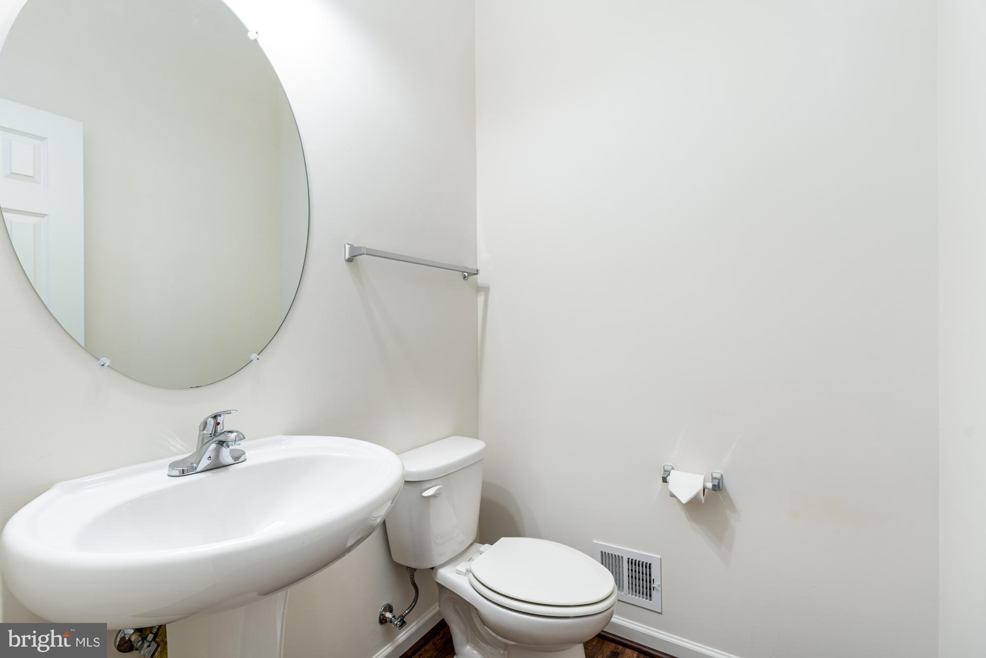 112 Prickly Pear Place Stephenson, VA 22656 - Photo 18 of 31 a bathroom with a sink a toilet and mirror