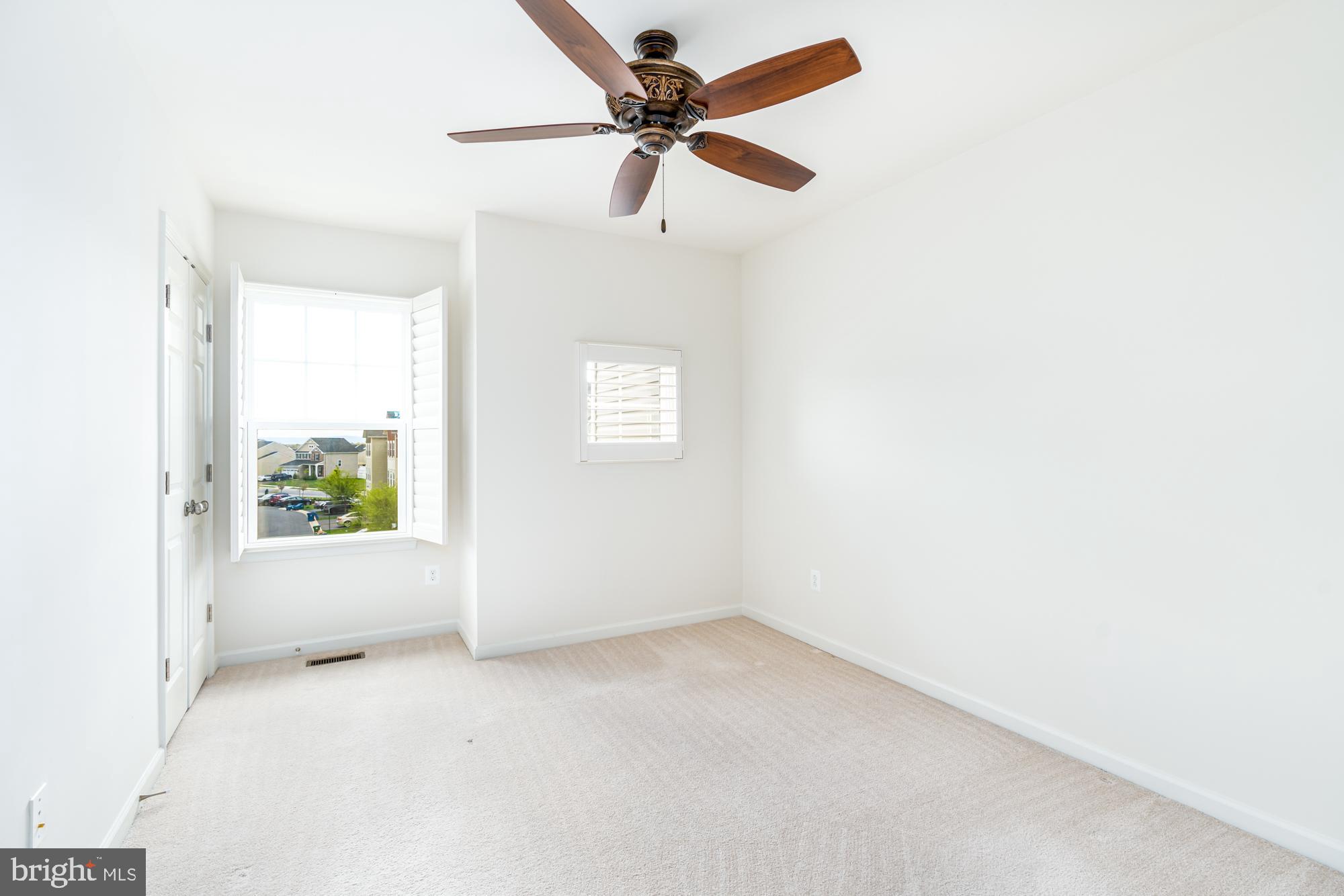 112 Prickly Pear Place Stephenson, VA 22656 - Photo 25 of 31 an empty room with a window and a ceiling fan