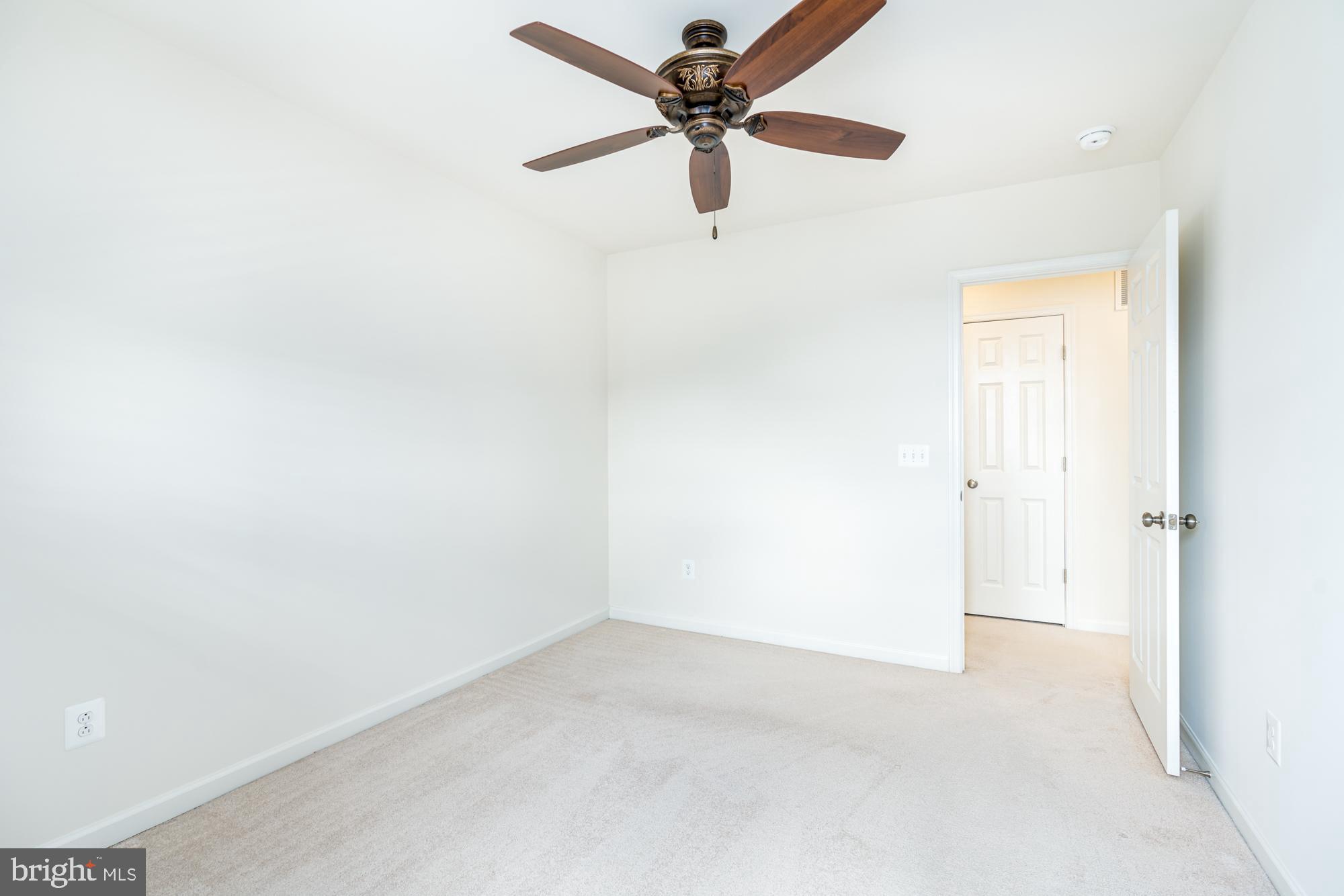 112 Prickly Pear Place Stephenson, VA 22656 - Photo 26 of 31 an empty room with a ceiling fan and a window