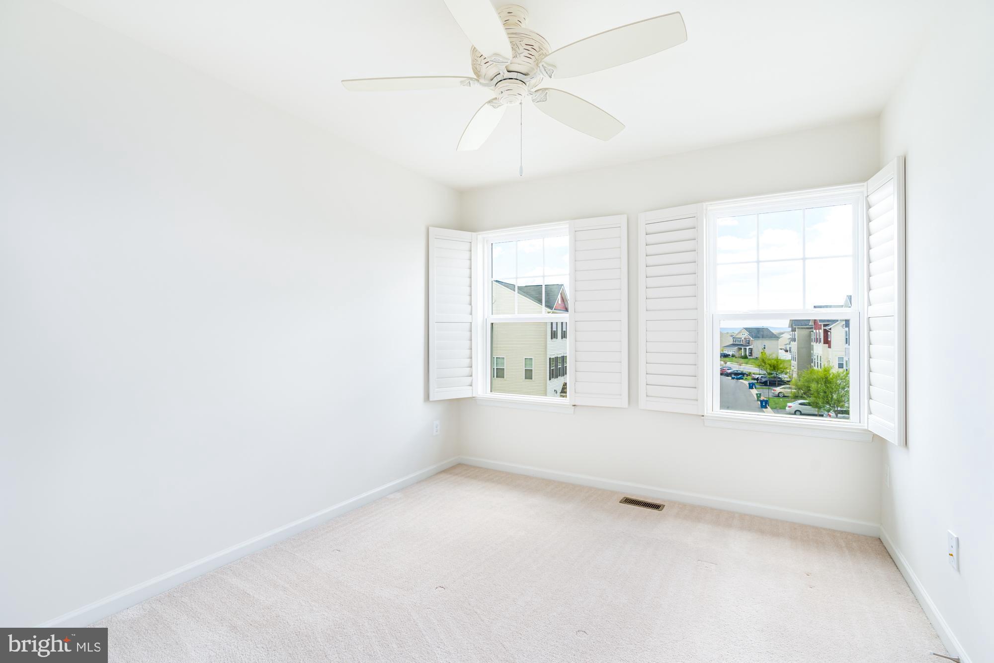 112 Prickly Pear Place Stephenson, VA 22656 - Photo 27 of 31 an empty room with a window and a ceiling fan