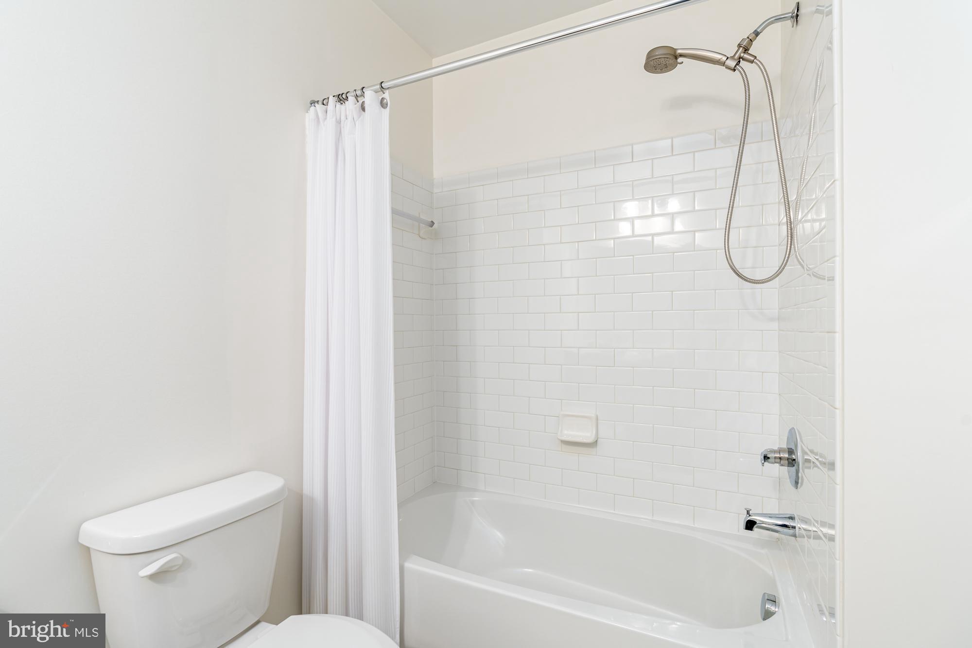 112 Prickly Pear Place Stephenson, VA 22656 - Photo 5 of 31 a bathroom with a bath tub and a shower