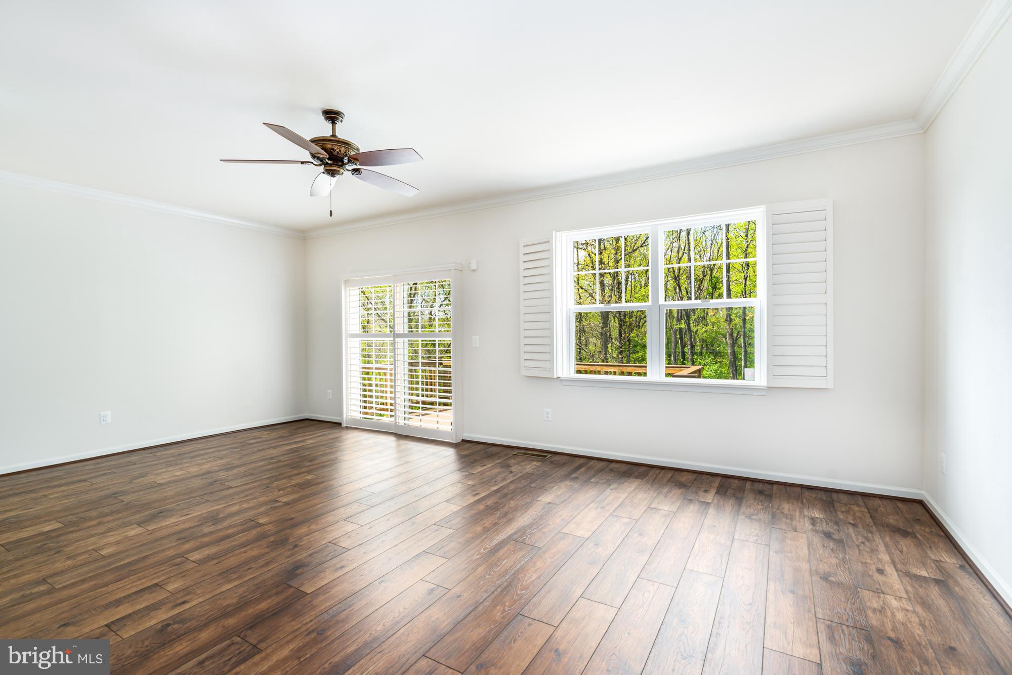 112 Prickly Pear Place Stephenson, VA 22656 - Photo 9 of 31 a view of an empty room with wooden floor and a window