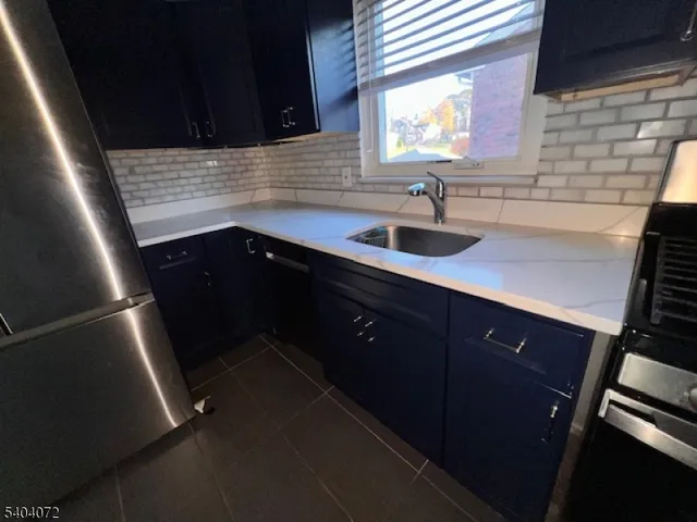 a kitchen with sink and window