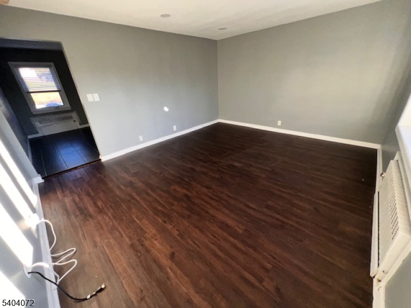 10 Federal Street, Unit 2 Belleville, NJ 07109 - Photo 5 of 10 a view of empty room with wooden floor and fan