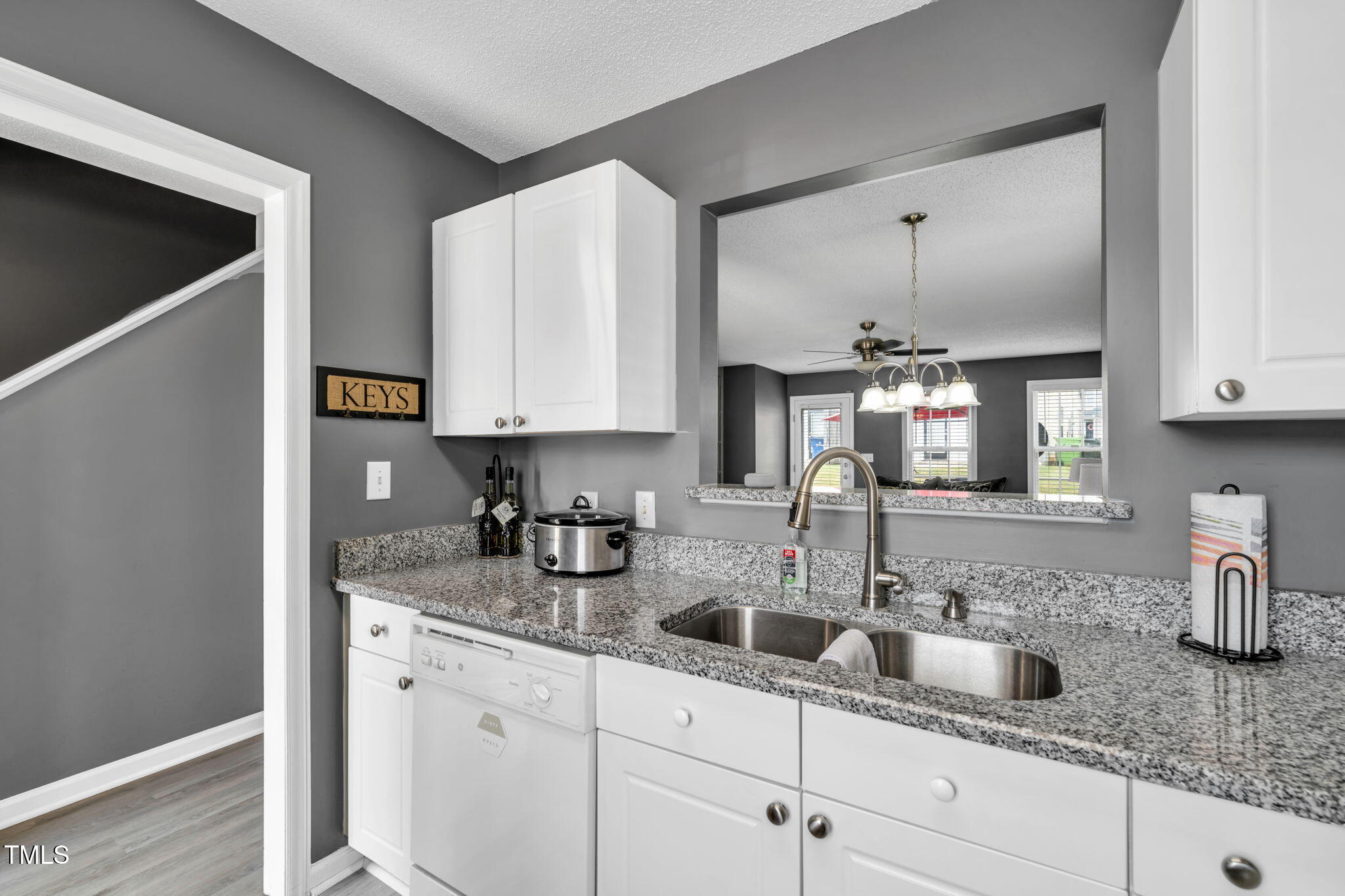 2203 Whistling Straits Way Raleigh, NC 27604 - Photo 10 of 31 a kitchen with stainless steel appliances granite countertop a sink and a white cabinets