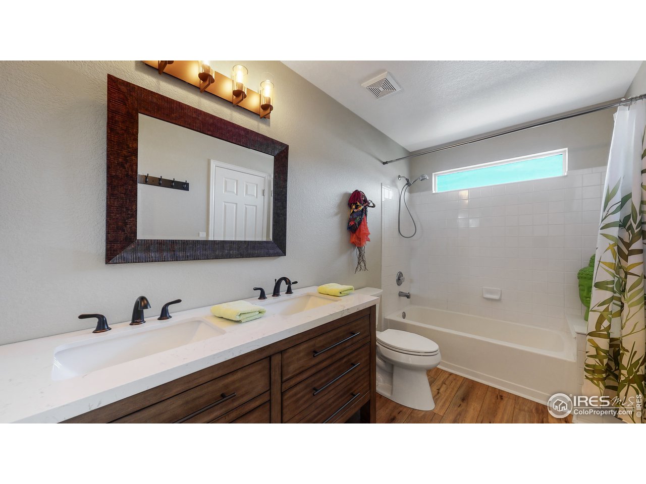 1278 Trail Ridge Road Longmont, CO 80504 - Photo 7 of 38 a bathroom with a toilet sink and mirror