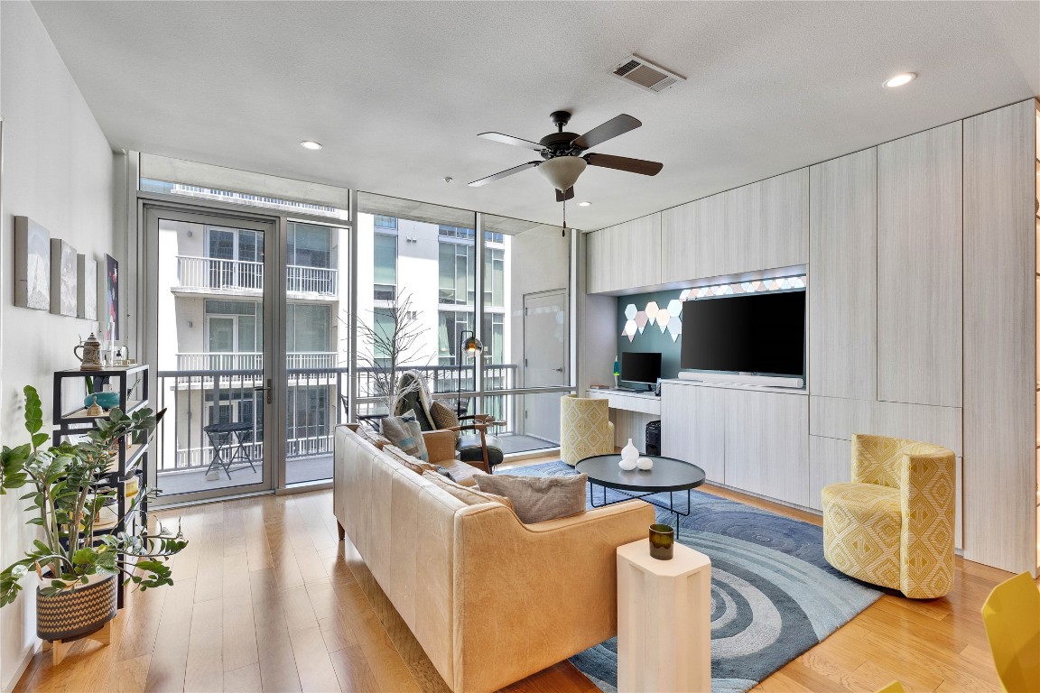 1600 Barton Springs Road, Unit 2403 Austin, TX 78704 - Photo 14 of 40 a living room with furniture and a flat screen tv