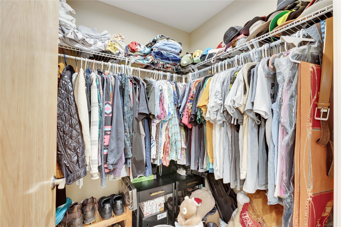1600 Barton Springs Road, Unit 2403 Austin, TX 78704 - Photo 19 of 40 a view of a walk in closet with clothes and shoes