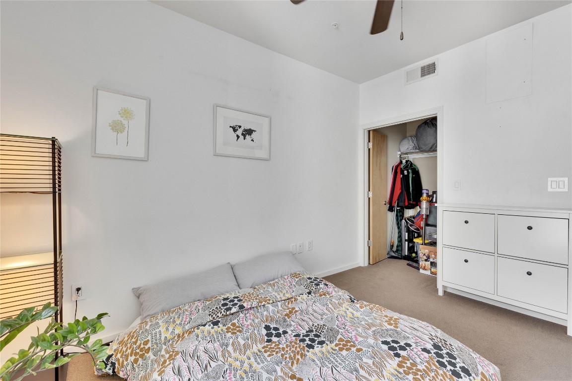 1600 Barton Springs Road, Unit 2403 Austin, TX 78704 - Photo 25 of 40 a bedroom with a bed and a couch