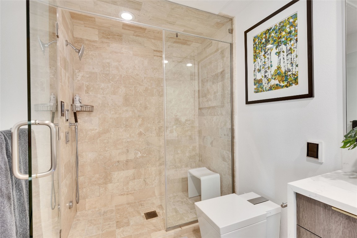 1600 Barton Springs Road, Unit 2403 Austin, TX 78704 - Photo 27 of 40 a bathroom with a shower a toilet and a sink
