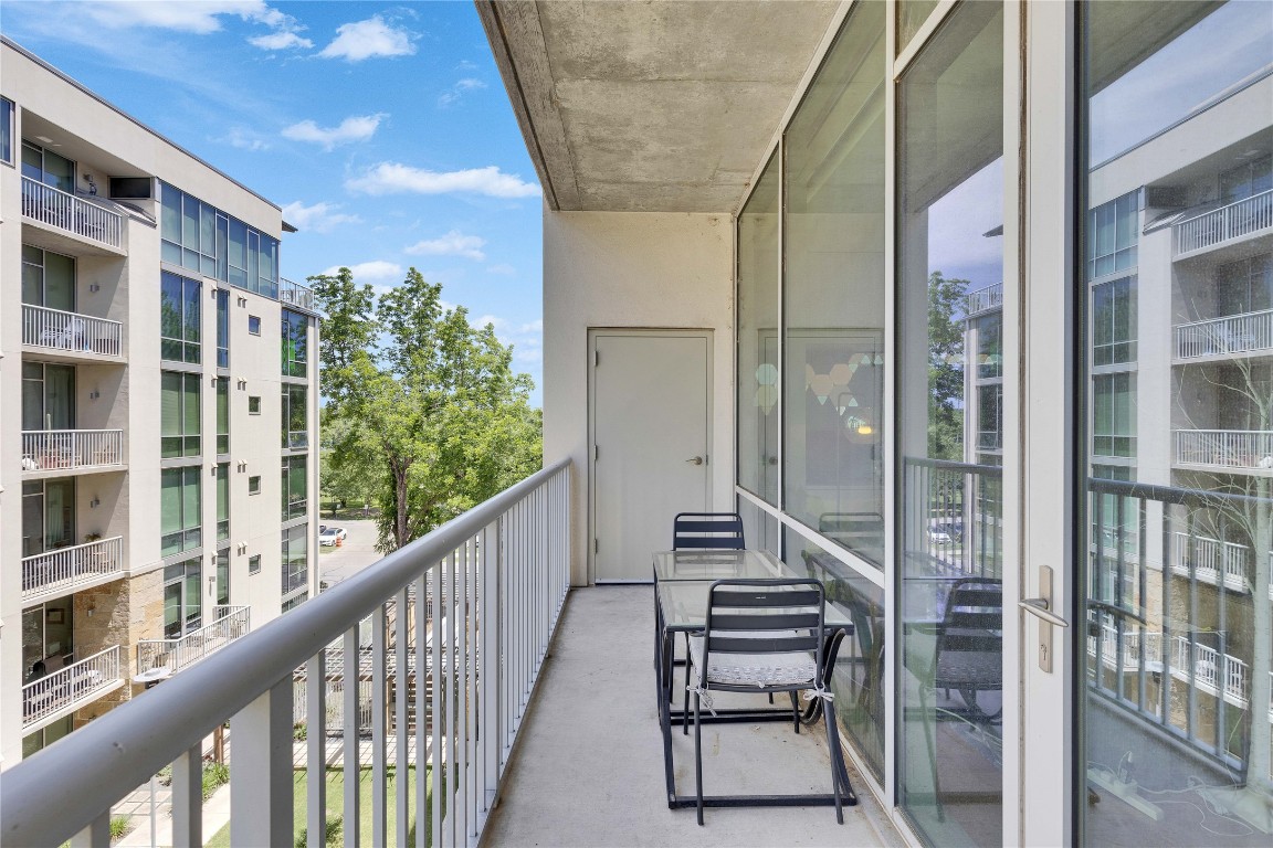 1600 Barton Springs Road, Unit 2403 Austin, TX 78704 - Photo 30 of 40 a view of balcony with wooden floor and fence