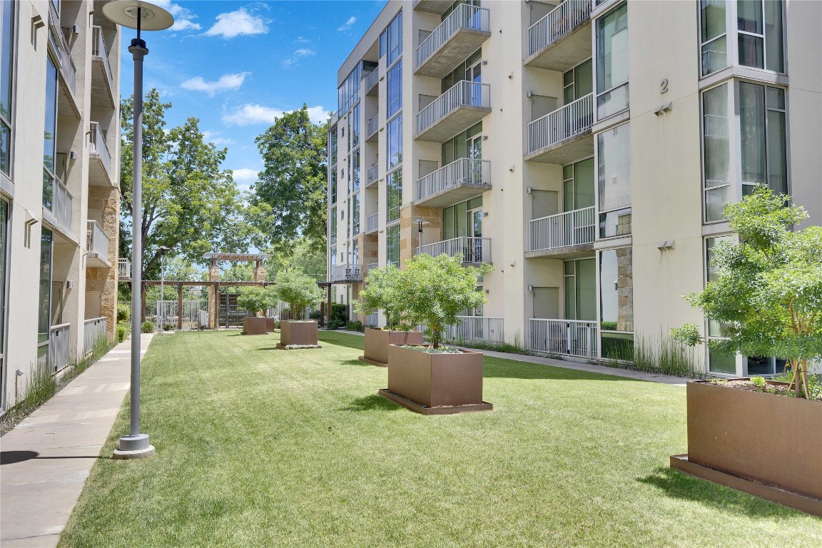 1600 Barton Springs Road, Unit 2403 Austin, TX 78704 - Photo 38 of 40 a view of a patio with couches and potted plants