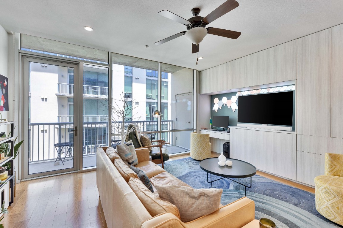 1600 Barton Springs Road, Unit 2403 Austin, TX 78704 - Photo 10 of 40 a living room with furniture and a flat screen tv