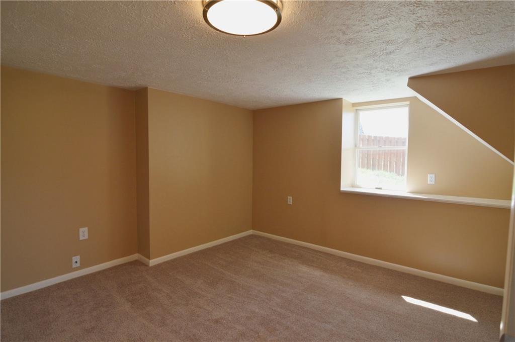 236 Hockey Road Tarrs, PA 15688 - Photo 23 of 25 Lower level bedroom - has game room just outside the bedroom door with exterior walk-out.