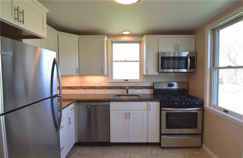 236 Hockey Road Tarrs, PA 15688 - Photo 9 of 25 Completely remodeled - floors, granite, stainless brand new, high end cabinets, lighting, etc..