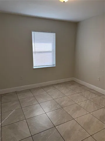 a view of a room that has a window in it