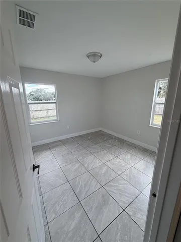 a view of an empty room and window