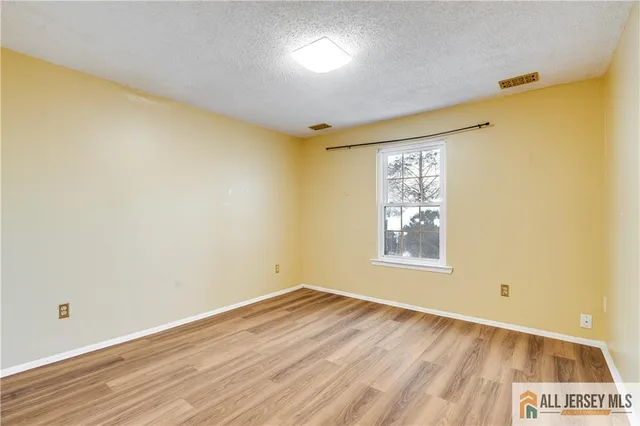 a bathroom with a sink mirror toilet and bathtub