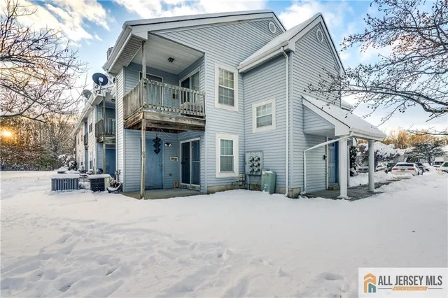 a view of a house with a snow in the yard
