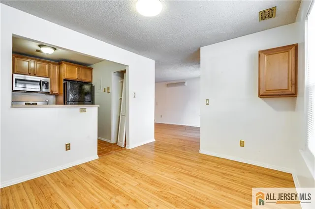 a bathroom with a sink vanity granite toilet tub and shower