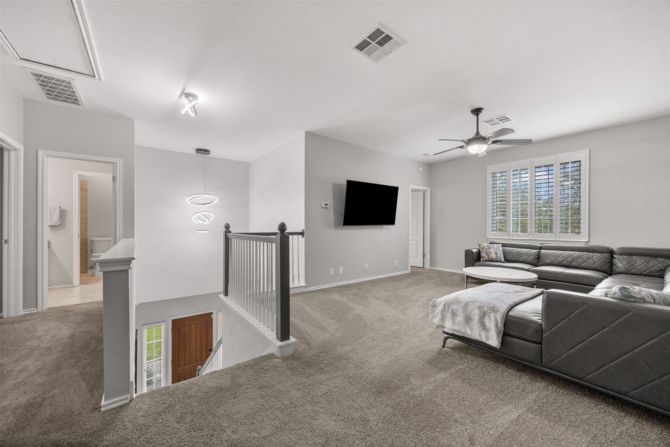 8610 Axis Drive Austin, TX 78749 - Photo 18 of 29 a spacious bedroom with a bed and a flat screen television