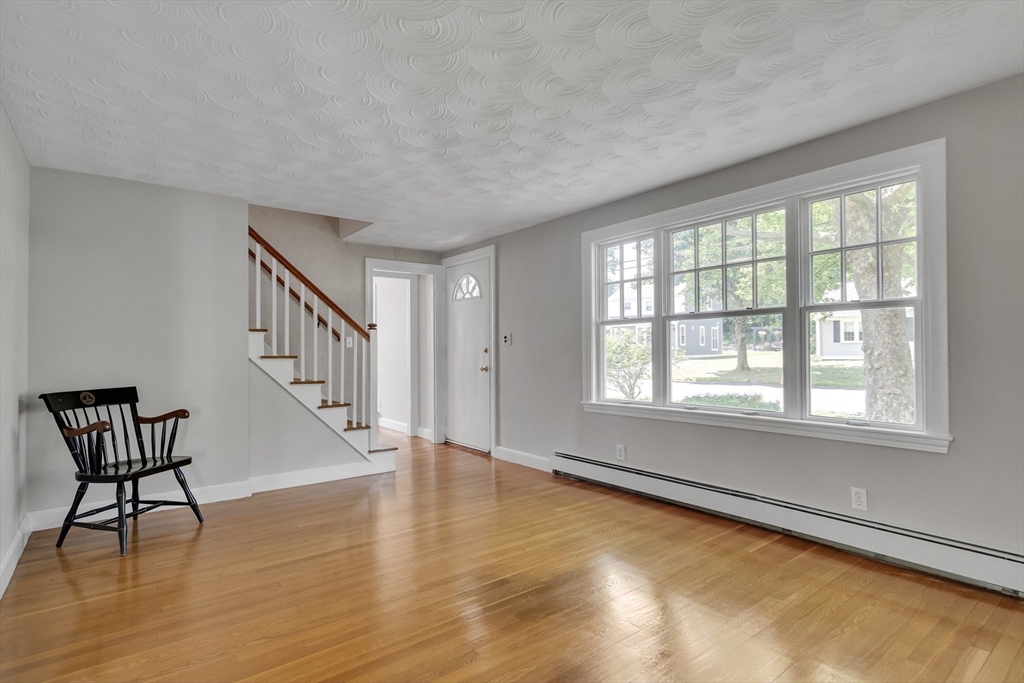 17 Beech Circle Andover, MA 01810 - Photo 18 of 36 wooden floor in an empty room with a window