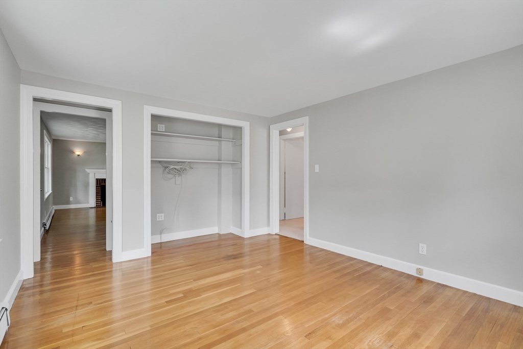 17 Beech Circle Andover, MA 01810 - Photo 20 of 36 a view of an empty room and wooden floor