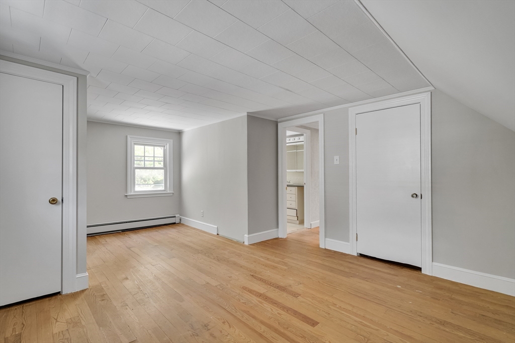 17 Beech Circle Andover, MA 01810 - Photo 30 of 36 a view of an empty room with wooden floor and window