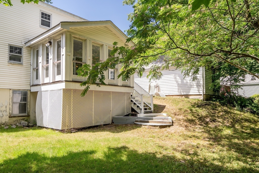 17 Beech Circle Andover, MA 01810 - Photo 6 of 36 a front view of a house with a yard