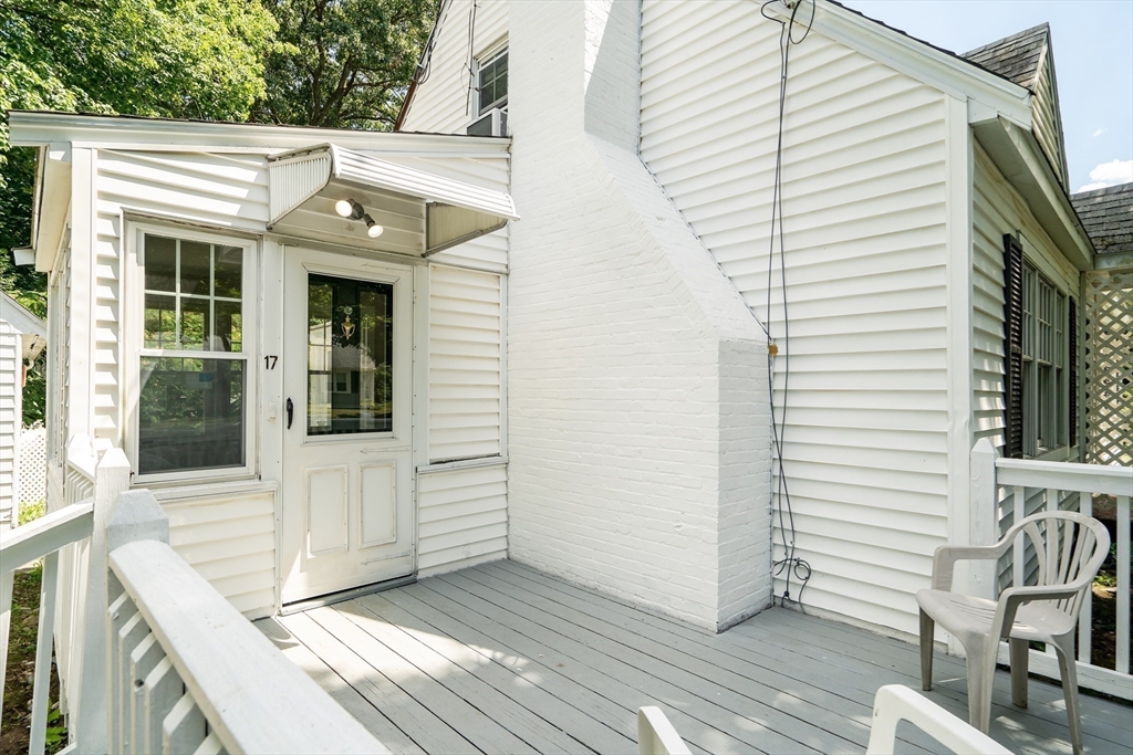 17 Beech Circle Andover, MA 01810 - Photo 7 of 36 a view of a white house with a sink and wooden floor