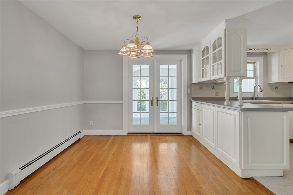 17 Beech Circle Andover, MA 01810 - Photo 9 of 36 a view of a room with wooden floor and windows