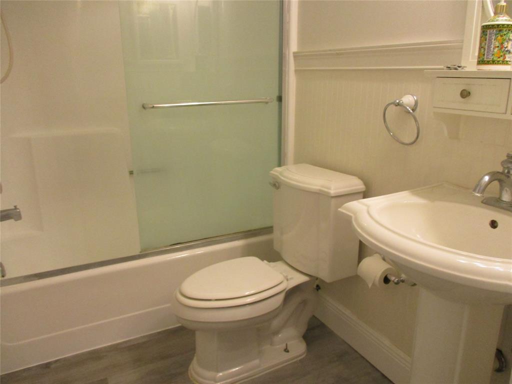 22040 Palms Way, Unit 205 Boca Raton, FL 33433 - Photo 13 of 19 a white toilet sitting next to a bathroom sink