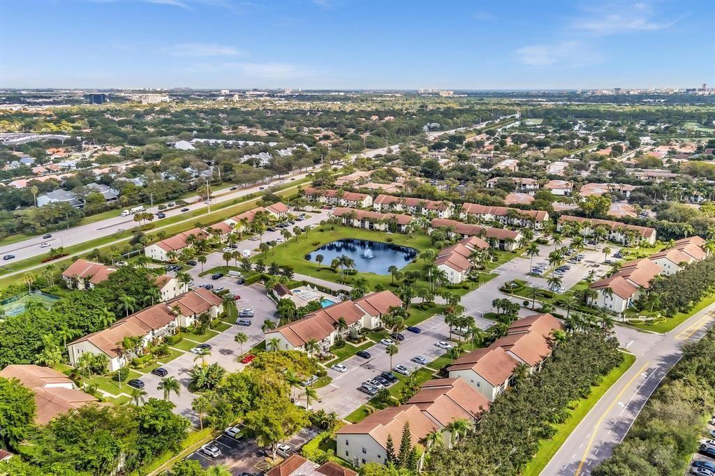 22040 Palms Way, Unit 205 Boca Raton, FL 33433 - Photo 17 of 19 an aerial view of residential houses with outdoor space