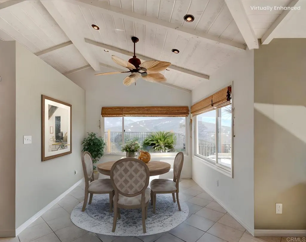 15753 Lyons Valley Road Jamul, CA 91935 - Photo 13 of 47 a dining room with furniture a window and a chandelier
