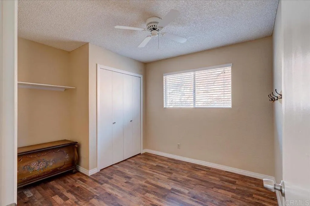 15753 Lyons Valley Road Jamul, CA 91935 - Photo 21 of 47 a view of an empty room with a window and a ceiling fan