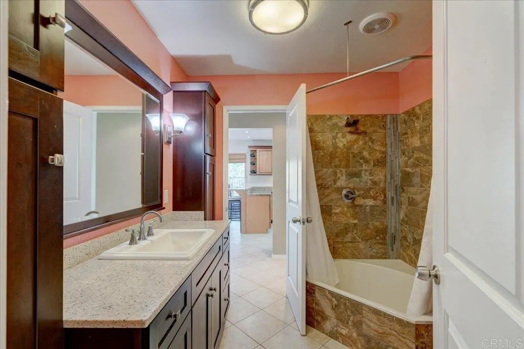 15753 Lyons Valley Road Jamul, CA 91935 - Photo 22 of 47 a bathroom with a granite countertop sink and a mirror