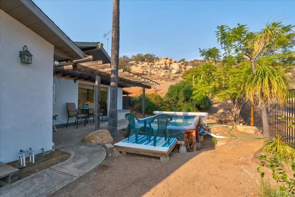 15753 Lyons Valley Road Jamul, CA 91935 - Photo 25 of 47 a view of a patio with table and chairs and potted plants