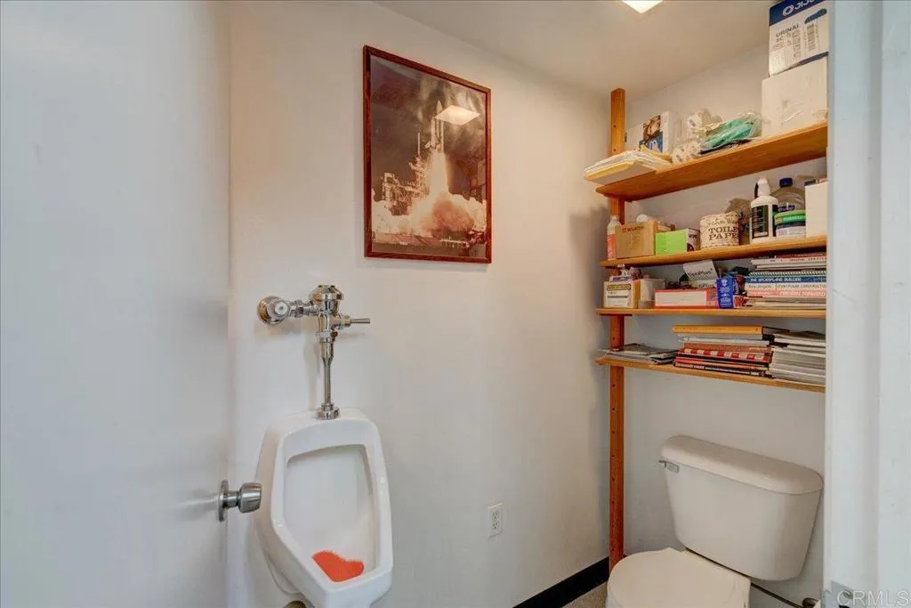 15753 Lyons Valley Road Jamul, CA 91935 - Photo 41 of 47 a bathroom with a toilet sink and mirror