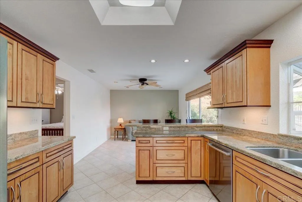 15753 Lyons Valley Road Jamul, CA 91935 - Photo 10 of 47 a kitchen with stainless steel appliances granite countertop a sink stove and cabinets