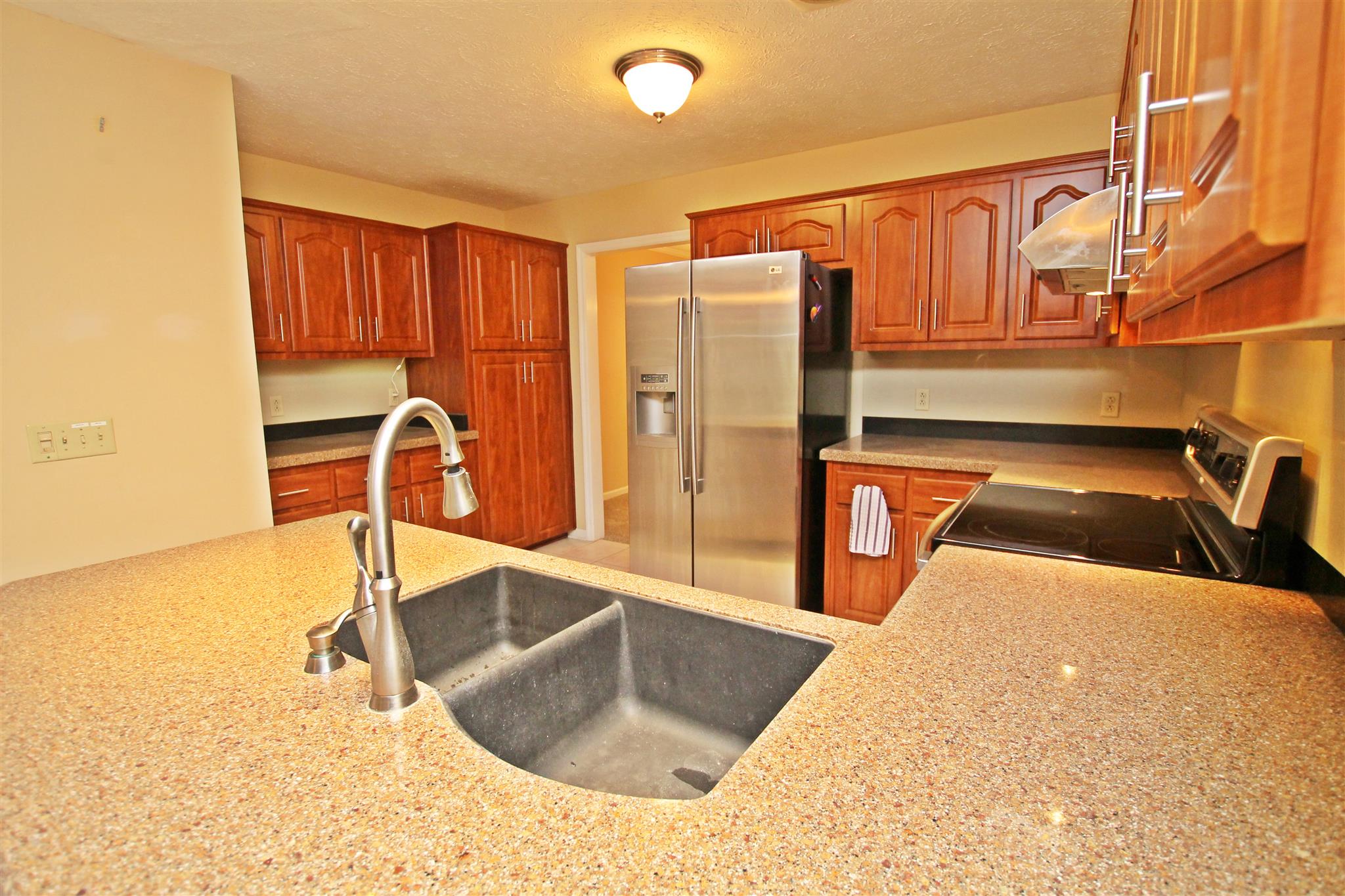 802 Deer Run Springfield, TN 37172 - Photo 8 of 25 a kitchen with stainless steel appliances granite countertop a sink and a refrigerator