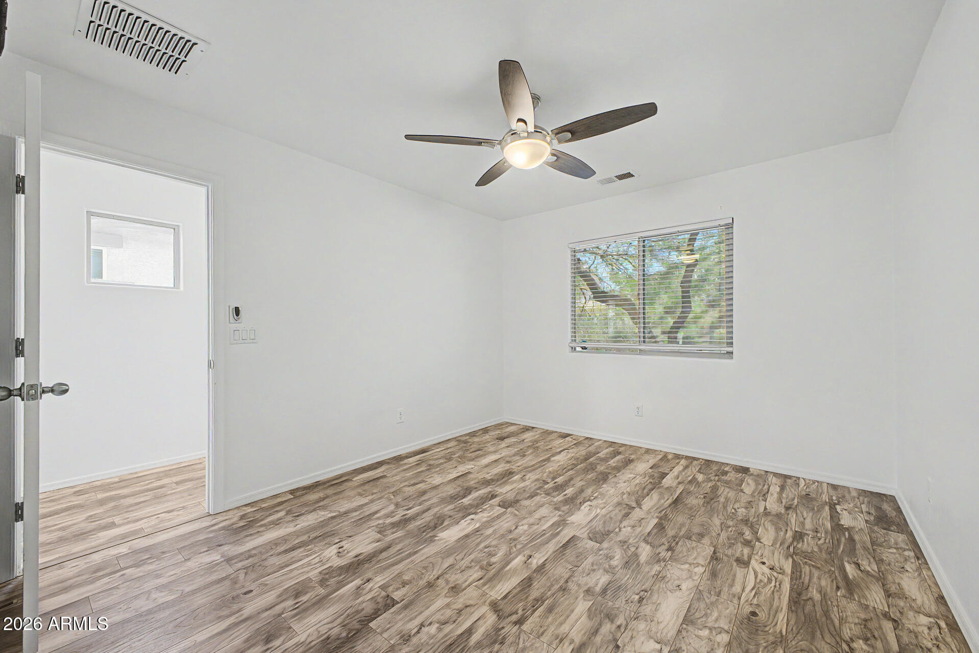 1882 West Rd Agent Street Apache Junction, AZ 85120 - Photo 16 of 26 a view of empty room with wooden floor