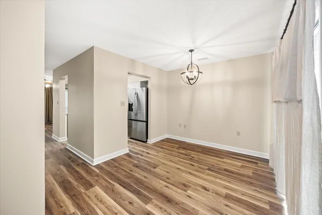 a view of a livingroom with wooden floor