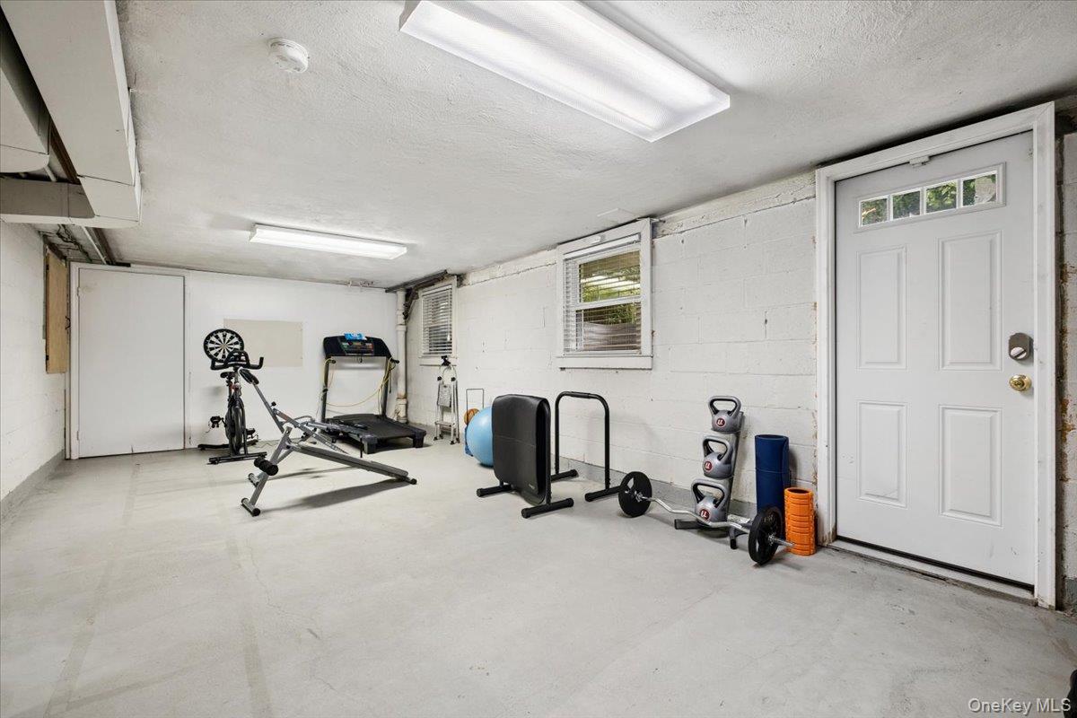 30 Stonehouse Road Scarsdale, NY 10583 - Photo 21 of 24 Unfinished basement with door to backyard.