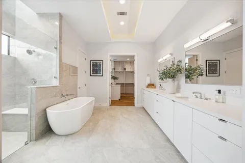 a bed room with a bed and a chair